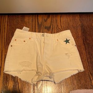 White Levi shorts with green star detailing!!